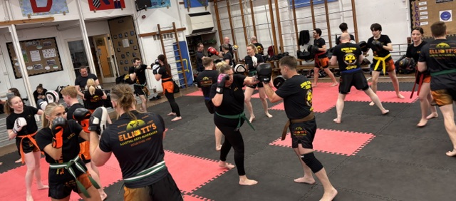 Mixed adult kickboxing class at Elliott’s Martial Arts Academies